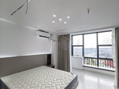 湖州吴兴凤凰出租凤起大厦一室一厅整租，奶油风，民用水电，密码锁，看房随时出租房源真实图片
