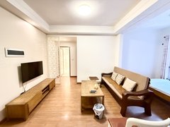 乐山市中万达广场出门就是万达！主卧带超大阳台！正看小区中庭！带全套家具家电！出租房源真实图片